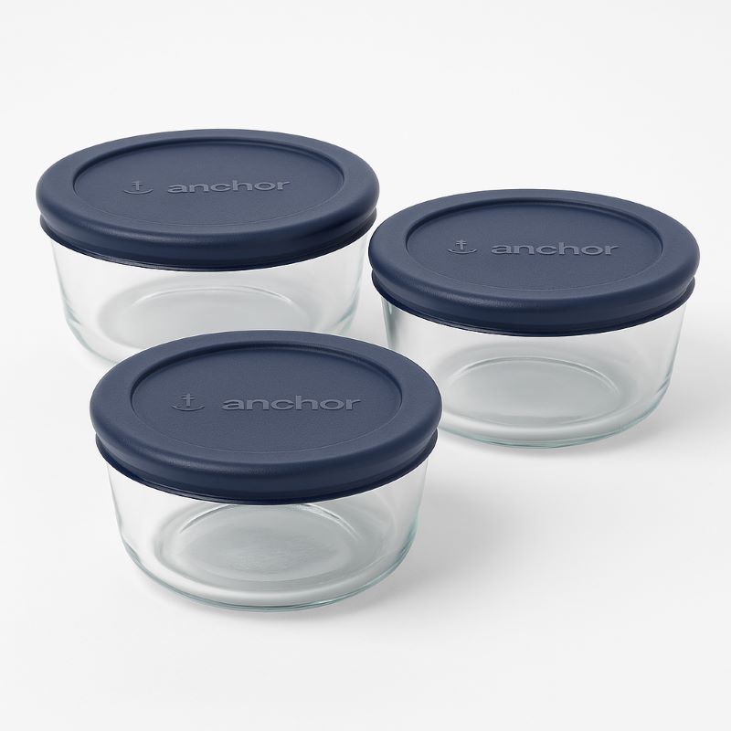 Medium glass containers fitted with navy blue SnugFit lids, showing Anchor logo on lid