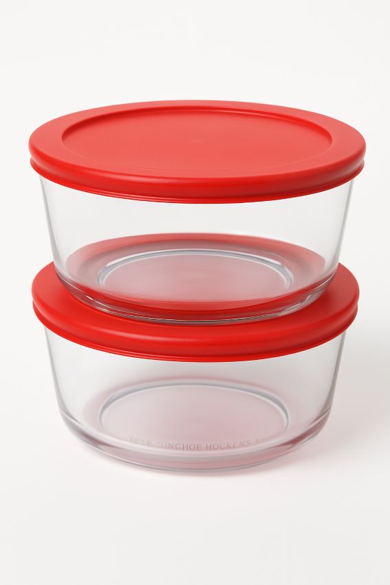 Two Anchor Hocking 7-cup round glass storage bowls stacked, with bright red lids sealing tightly