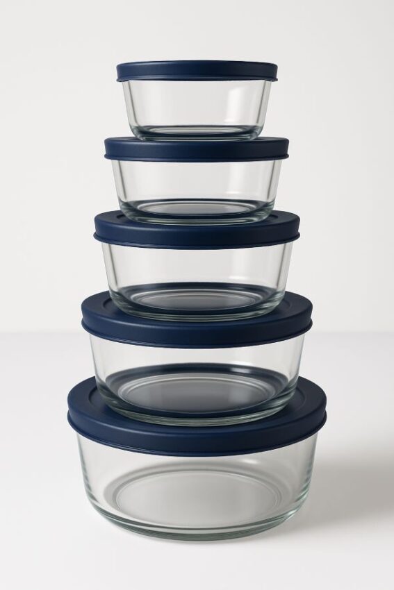 Anchor Hocking 12‑piece set: four 1‑cup and two 4‑cup tempered glass containers perfectly stacked with navy blue SnugFit lids