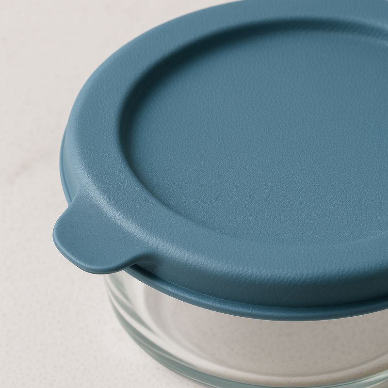 Close‑up of Mineral Blue lid on glass container showing textured surface and pull‑tab edge