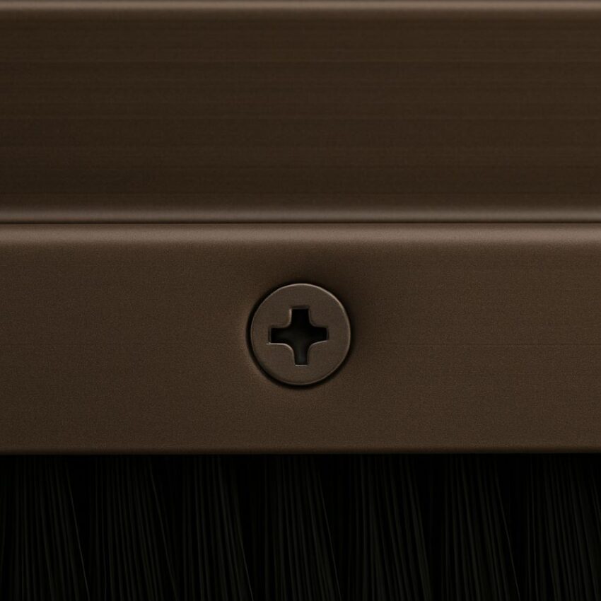 Color‑matched plated #6 × 5/8″ screw head flush with dark bronze extrusion