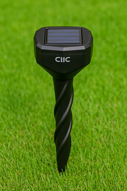 CIIC solar‑powered ultrasonic repeller stake installed in grass lawn, showing the solar panel on top and spiral stake penetrating the soil