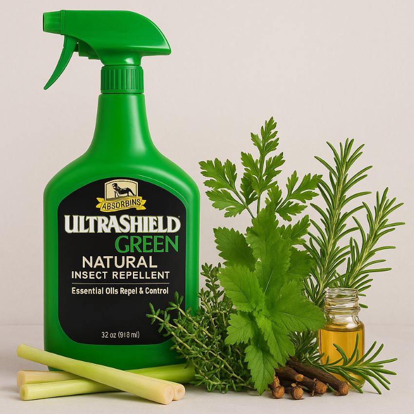 UltraShield Green bottle beside fresh herbs and oils—lemongrass, thyme, citronella, clove, rosemary, cedarwood
