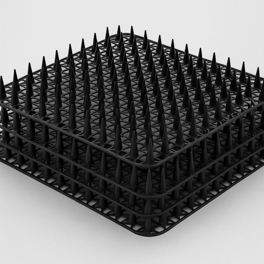 Stacked 16 × 12 inch black polypropylene cat scat mats with visible one‑inch blunt spikes