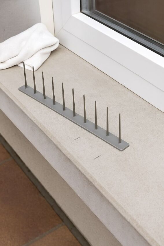 Cleaned window sill with spike strip dry-fitted before bonding