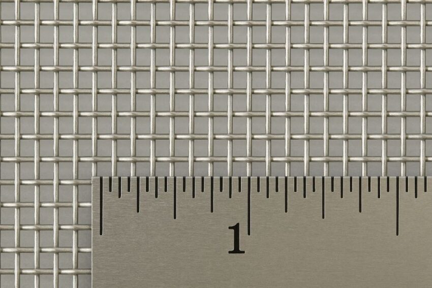Macro of 10-mesh stainless screen with ruler showing ten wires per inch