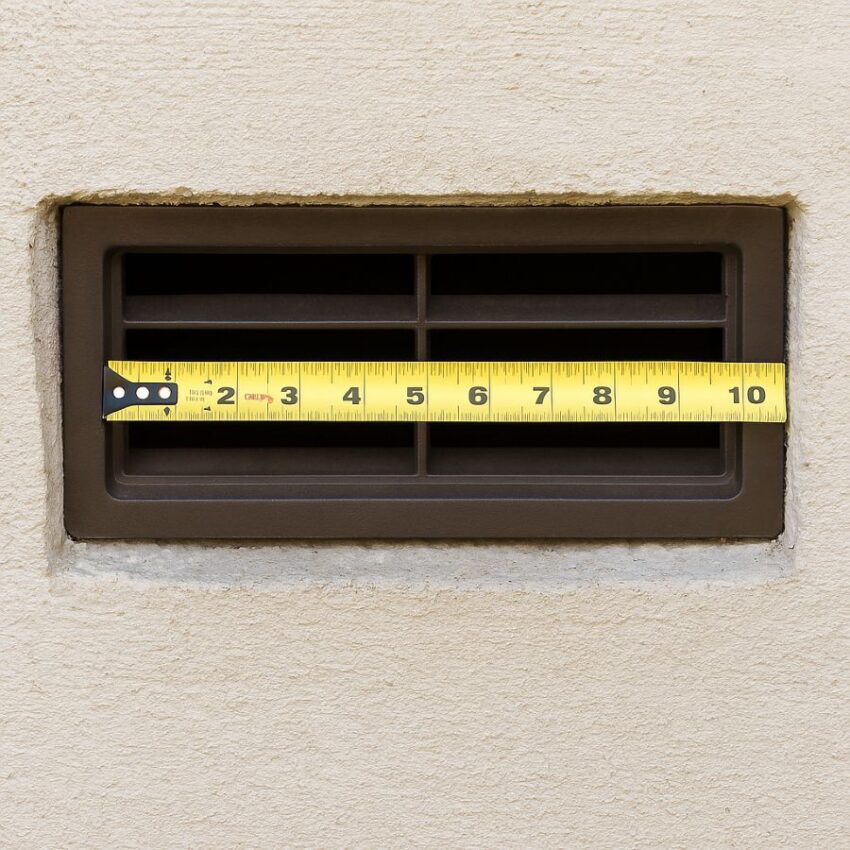 Measuring the inside opening of a foundation vent and confirming the center mullion