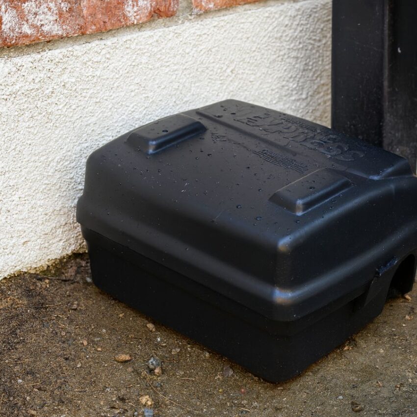 Protecta EVO Express bait station placed along an exterior wall for outdoor rodent control.