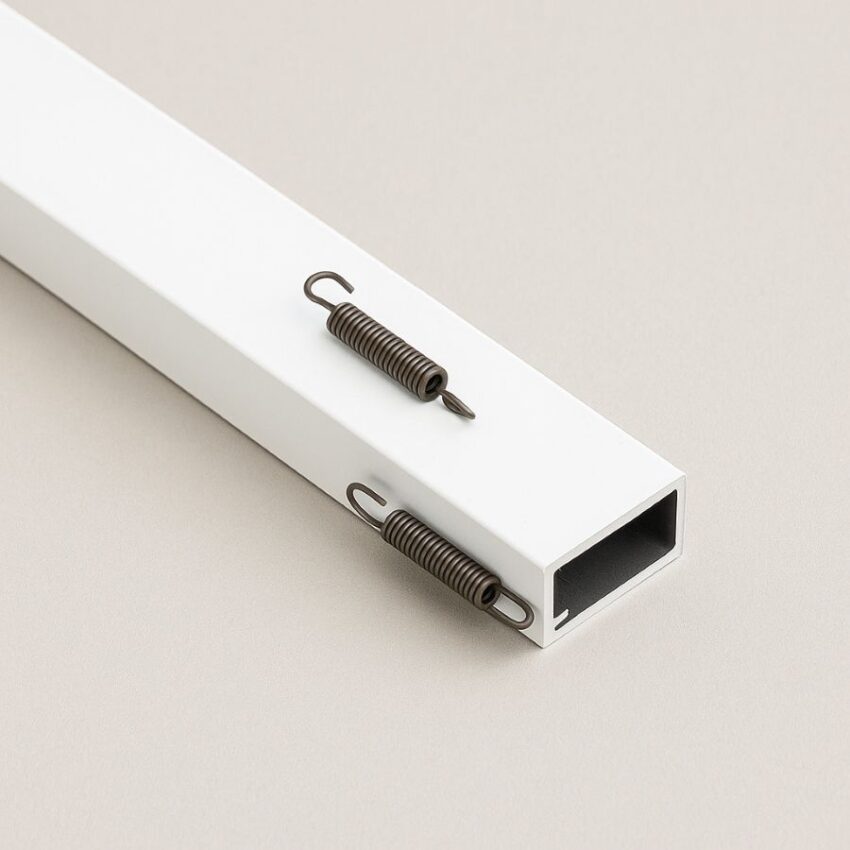 Side tension springs installed on one rail for loading the screen into the deep window channel