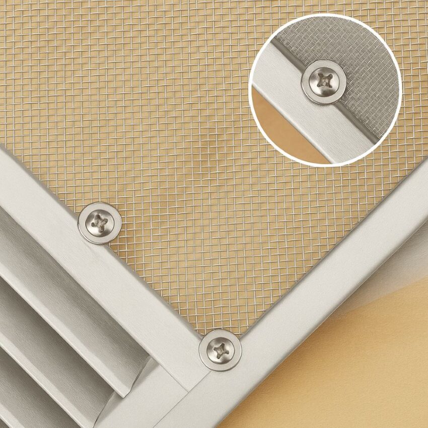 Stainless screws and nylon washers securing mesh to an aluminum louver to reduce galvanic corrosion