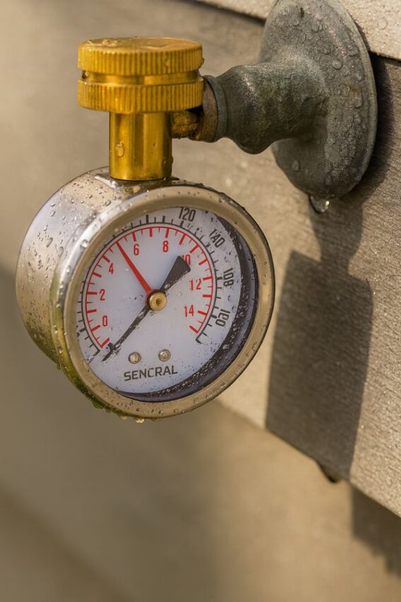 Water pressure gauge with lazy hand attached to a garden hose spigot, stainless case and 2.5 inch dial.